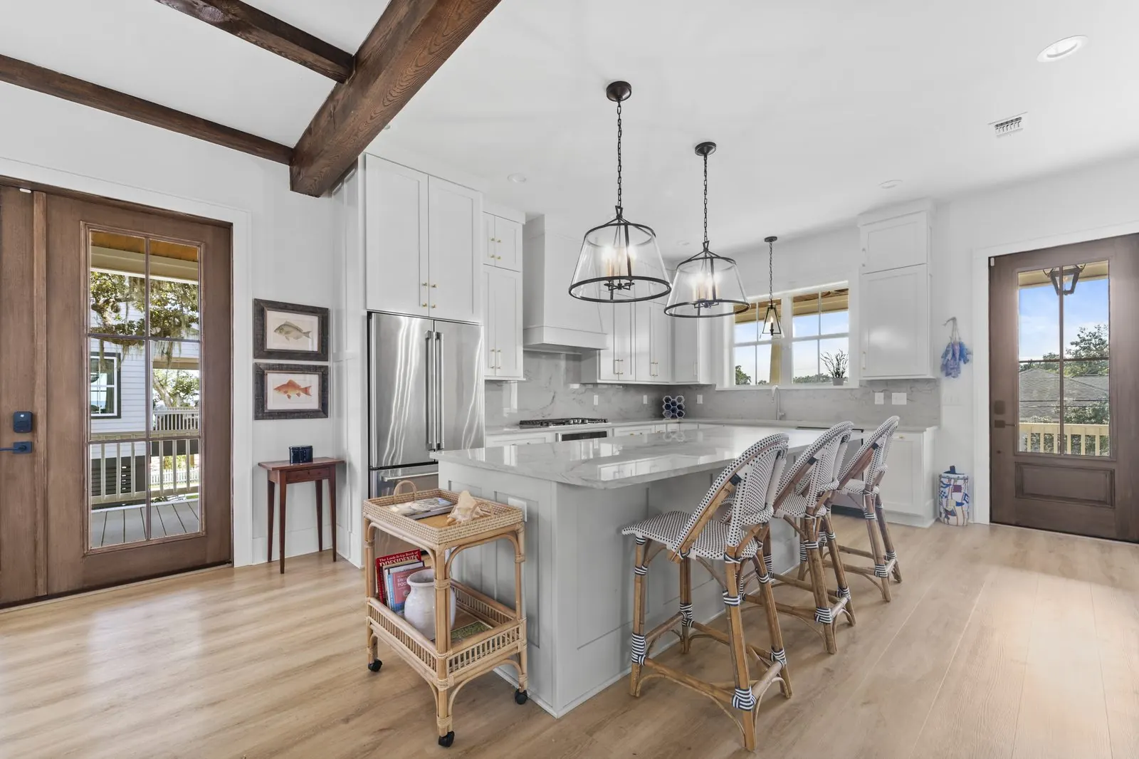 White kitchen with island and pendants